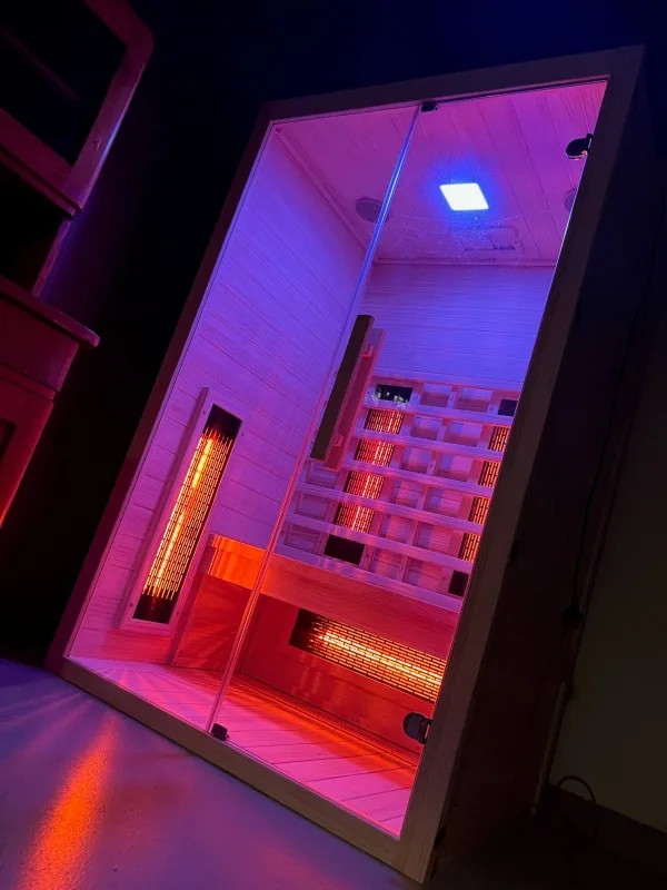JJSPA JIO120 infrared sauna with lights on in the dark