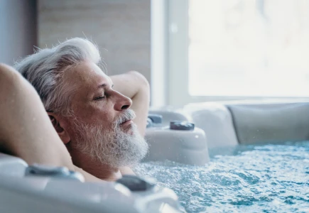 How does a hot tub help with headaches?